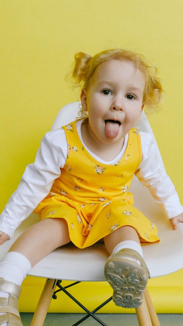 girl-in-white-and-yellow-long-sleeve-dress-doing-funny-face-3771648